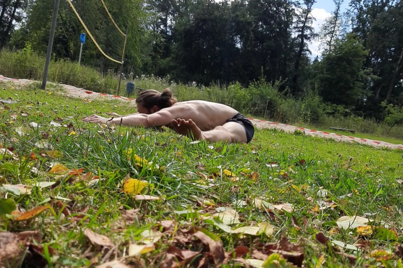 This image shows me training outdoors and performing a pancake stretch.