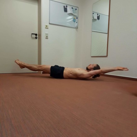 This is me performing a straight hollow body hold.