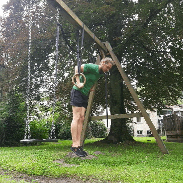 This image shows the Muscle Up transition on Gymnastic Rings.