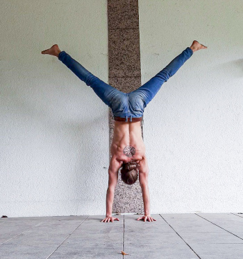 This is my Author Photo showing me doing a straddled Wall Handstand.