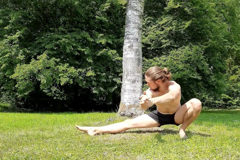 This image shows em doing a leg workout and performing a cossack squat.