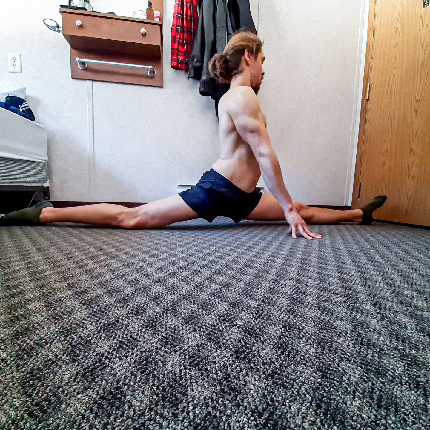 This image shows me performing front splits, one fundamental lower body flexibility position.