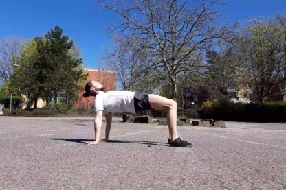 This image shows me performing a yoga table top pose.