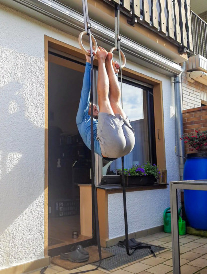 This image shows me doing a hanging leg raise on rings.