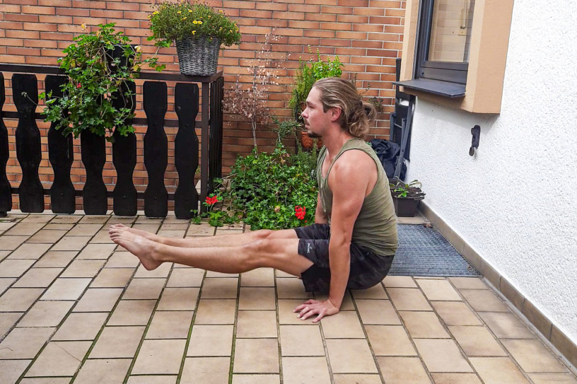 Me doing an l-sit on the floor - a splendid core and hip flexor exercise for compression strength.