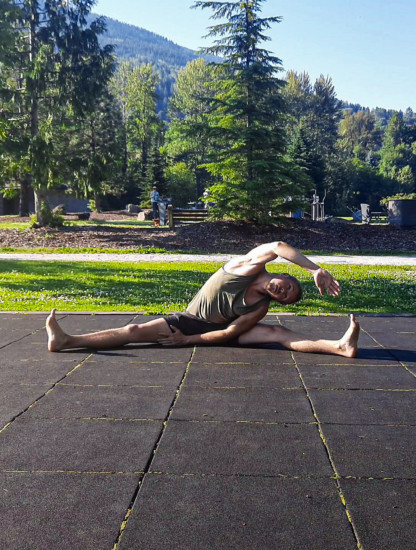 This image shows me performing a straddle side bend, an active dynamic fleixibility drill.